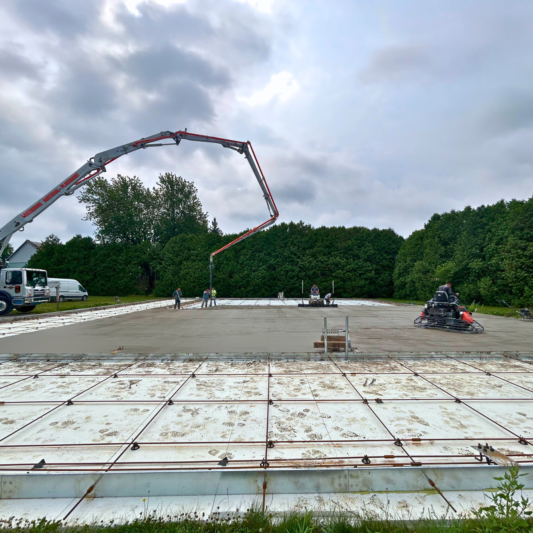 steel building experts pouring a foundation