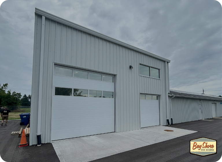 commercial steel shop building with large overhead doors