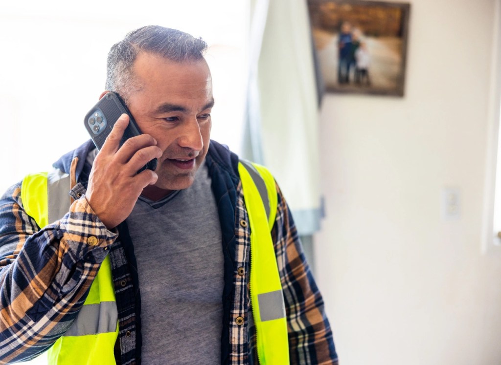 Steel building contractor reviewing metal building plans and cost estimate for a commercial steel structure project in Ontario